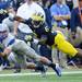 Air Force wide receiver Chris Jordan reaches for a pass around Michigan defensive back Raymon Taylor during the second half at Michigan Stadium on Saturday. Melanie Maxwell I AnnArbor.com
